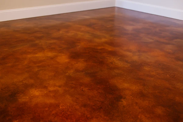 a red epoxy floor from Concrete Contractor Bulls Prime in Round Rock, TX - Concrete Cutting Company